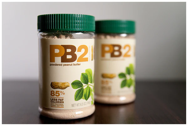 Two jars of PB2 on a table